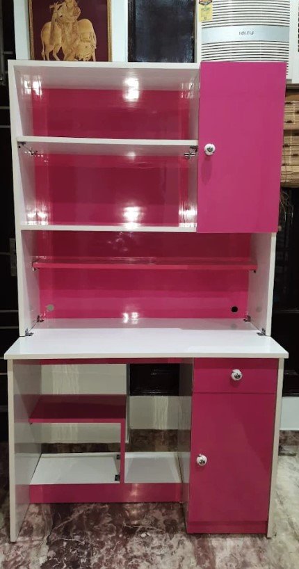 Completed pink and white study desk with shelves and cabinets